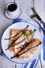 Delicious pancakes with blueberries on table close-up
