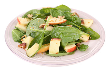 Green salad with apples, walnuts and cheese isolated on white