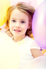 Fototapeta na wymiar Portrait of beautiful girl posing with balloons