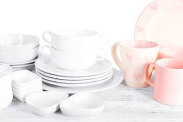 Fototapeta premium Different tableware on shelf, isolated on white