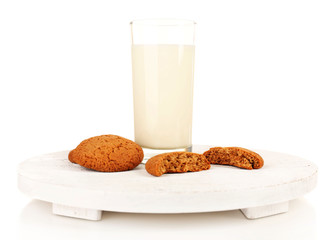 Milk and cookies on wooden tray isolated on white