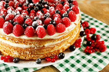 Tasty cake with fresh berries on table, close up
