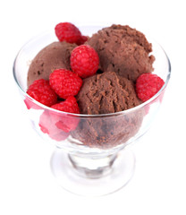 Chocolate ice cream with raspberries in glass bowl, isolated