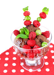 Chocolate ice cream with mint leaf and  ripe berries in glass