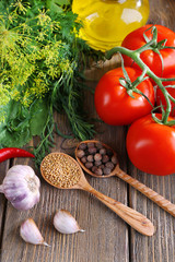 Fresh vegetables with herbs and spices on table, close-up