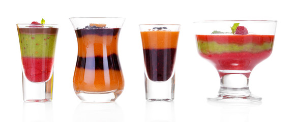 Glasses of tasty smoothies, isolated on white