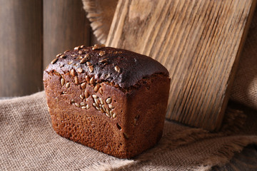 Fresh bread on wooden table, close up