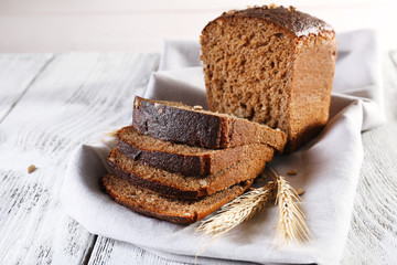 Fresh bread on wooden table, close up