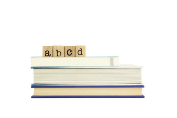 abcd word on wood stamps and books