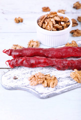 Tasty oriental sweets (churchkhela) and fresh nuts,