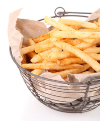 Tasty french fries in metal basket, isolated on white