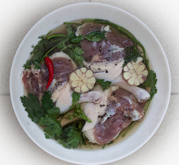 raw duck leg marinating