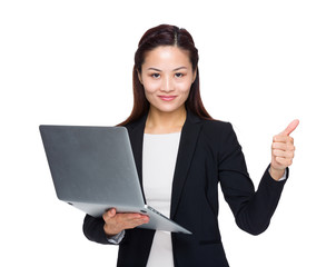 Businesswoman hold laptop computer and thumb up