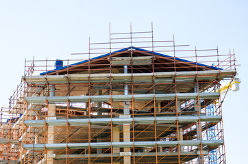 House exterior in construction and crane