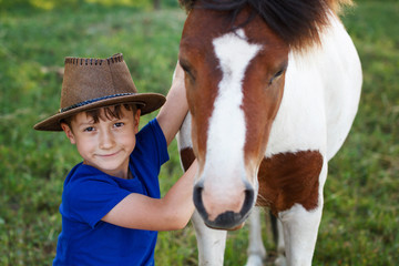 Little boy with pony