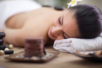Young woman relaxing at spa salon