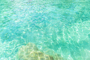 Fototapeta na wymiar Emerald pool with sunny reflections