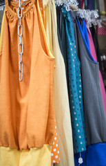 clothes on a rack on a flea market