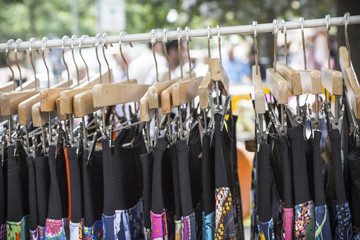 clothes on a rack on a flea market