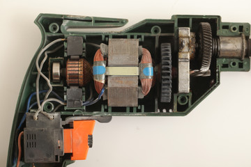 disassembled cordless drill white background