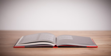 Open book on wooden deck