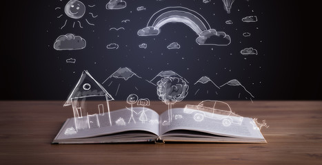 Open book with hand drawn landscape