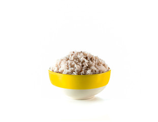 cooked brown rice in yellow ceramic bowl