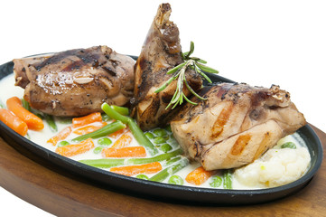 roasted rabbit meat and potatoes with vegetables