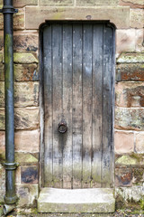 Fototapeta na wymiar Rustic worn Medieval Door