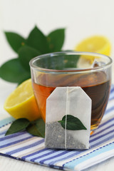 Tea bag, tea and fresh lemon