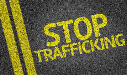 Stop Trafficking written on the road
