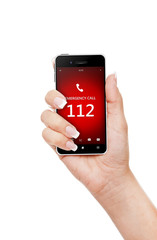 hand holding mobile phone with emergency number 112
