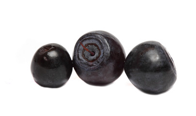 three ripe blueberries