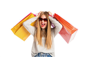 Excited shopping woman isolated on white