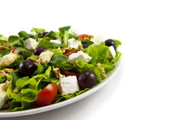 Obraz na płótnie Canvas Salad with cheese on white background