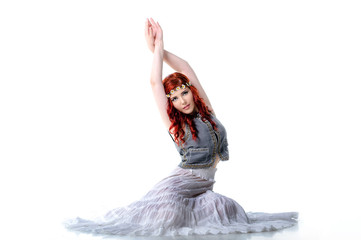 Young belly dancer isolated on white background