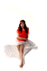 Naklejka premium young redhead dancer in ethnic costume