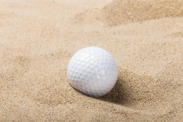 golf ball on the sand background