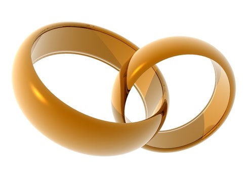 Wedding rings. Two gold rings on a light background.