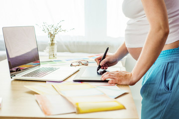 Pregnant woman working from home