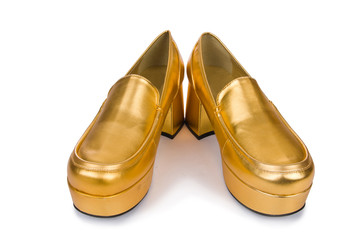 Golden woman shoes isolated on the white