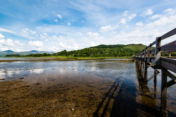 Scottish landscape with wooden footbridge