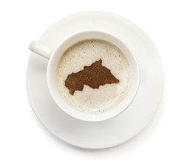 Obraz premium Cup of coffee with foam and powder in the shape of Central Afric