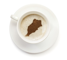 Cup of coffee with foam and powder in the shape of Morocco.(seri