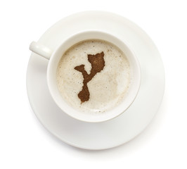 Cup of coffee with foam and powder in the shape of Mozambique.(s