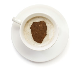 Cup of coffee with foam and powder in the shape of Sierra Leone.