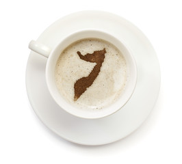Cup of coffee with foam and powder in the shape of Somalia.(seri