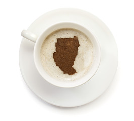 Cup of coffee with foam and powder in the shape of Sudan.(series