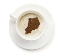 Cup of coffee with foam and powder in the shape of Uganda.(serie