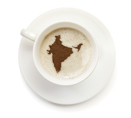 Cup of coffee with foam and powder in the shape of India.(series
